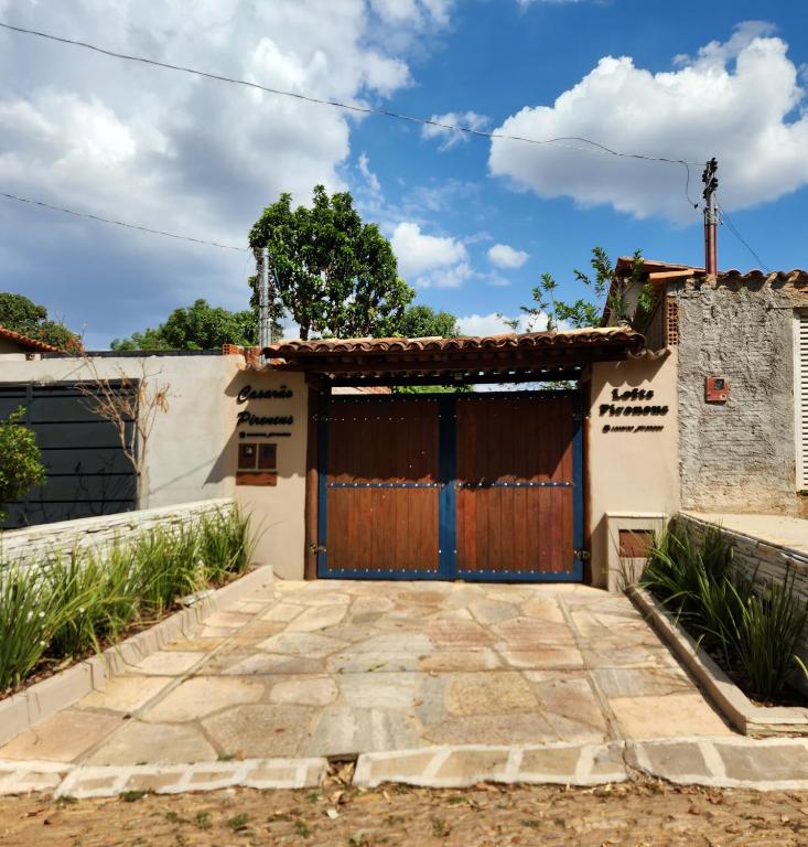 a gate to a house in a village at Loft Pireneus 1 in Pirenópolis