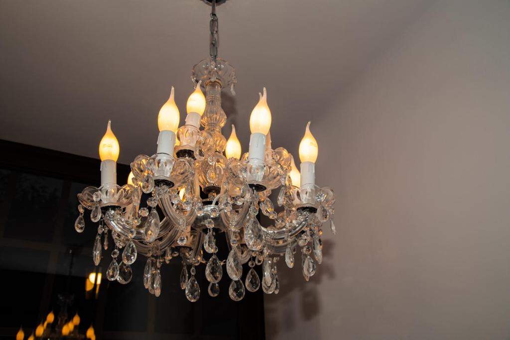 a chandelier hanging from a ceiling at Kaunas Embassy Apartments in Kaunas