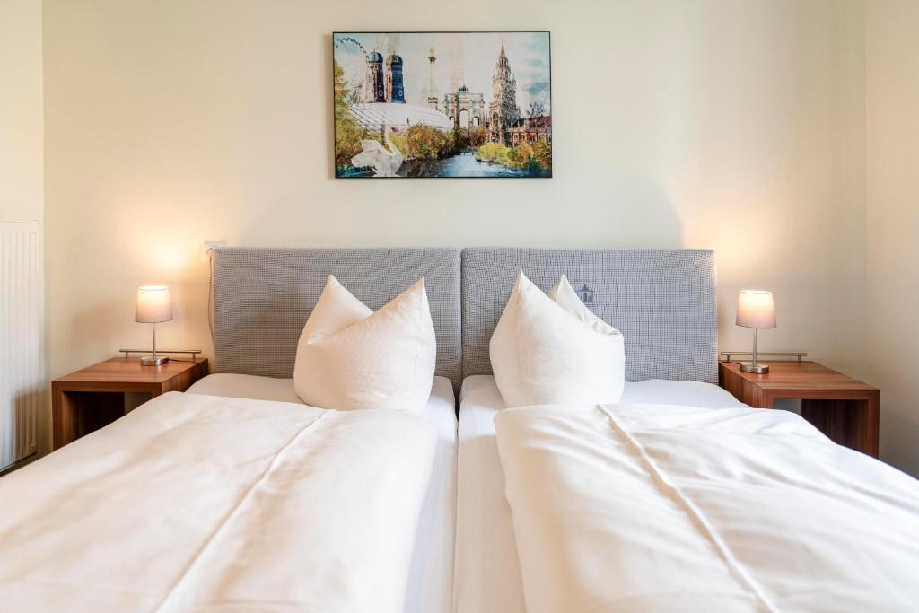 Postel nebo postele na pokoji v ubytování Hotel-Pension am Siegestor