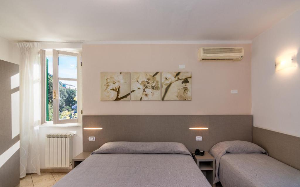Postel nebo postele na pokoji v ubytování Hotel Eura