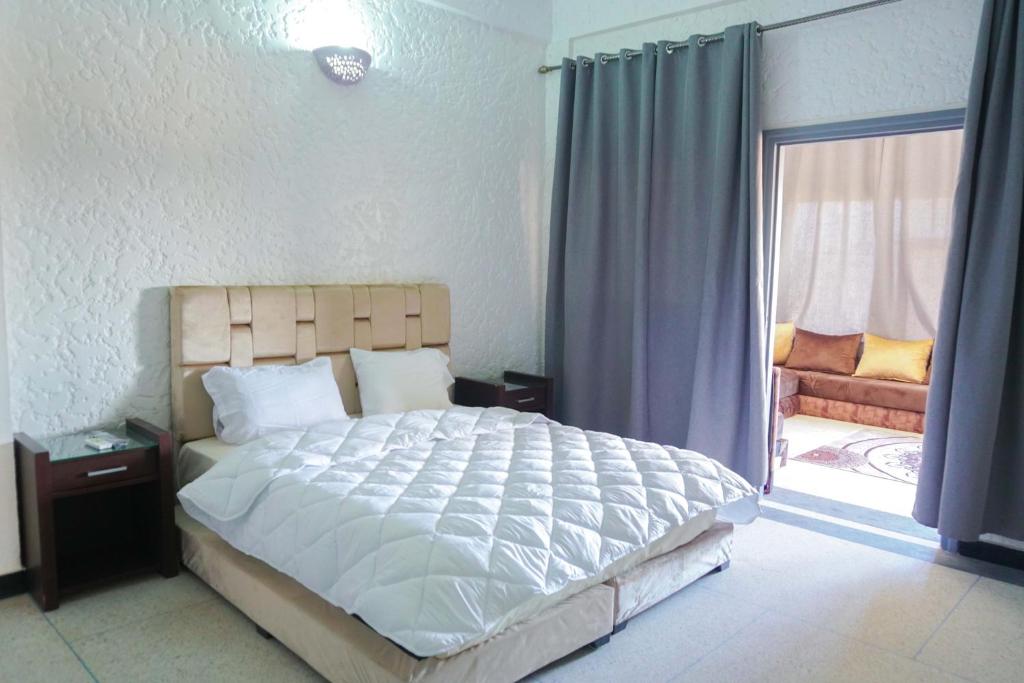 Postel nebo postele na pokoji v ubytování Hotel Warda
