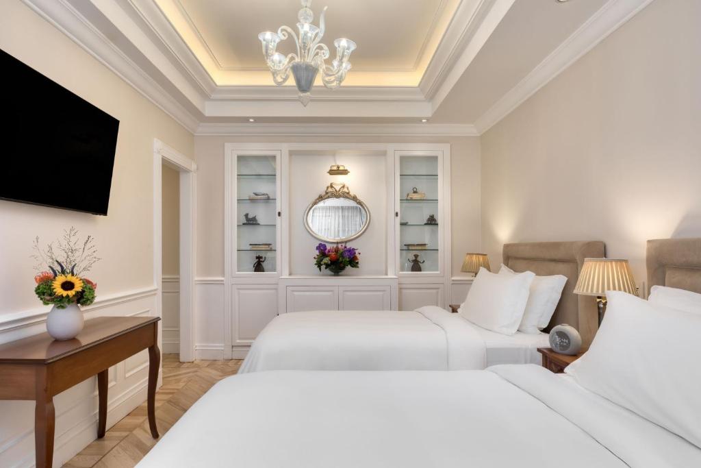 Postel nebo postele na pokoji v ubytování King George, a Luxury Collection Hotel, Athens