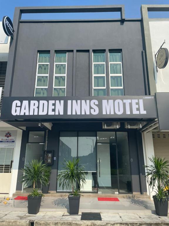 a building with a sign that reads garden interns motel at Garden Inns Motel in Kangar