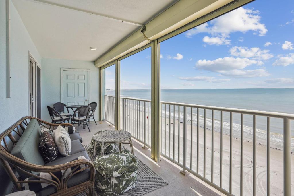 a living room with a view of the beach at Arena De Madeira 502- Premier in St. Pete Beach