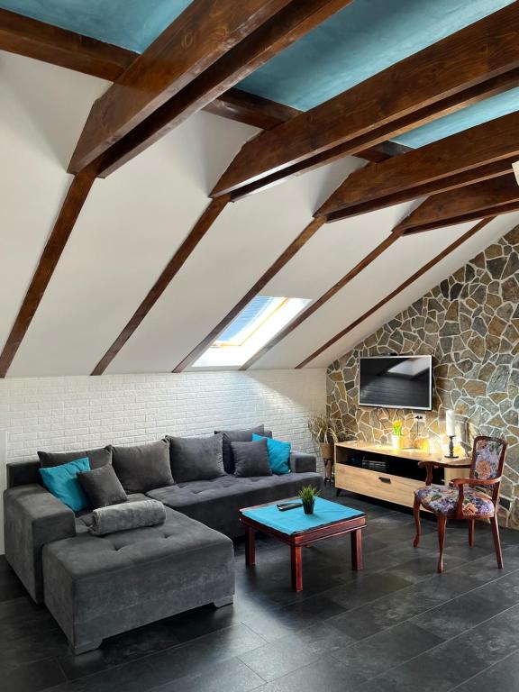 a living room with a couch and a table at Apartment No10 in Golubac
