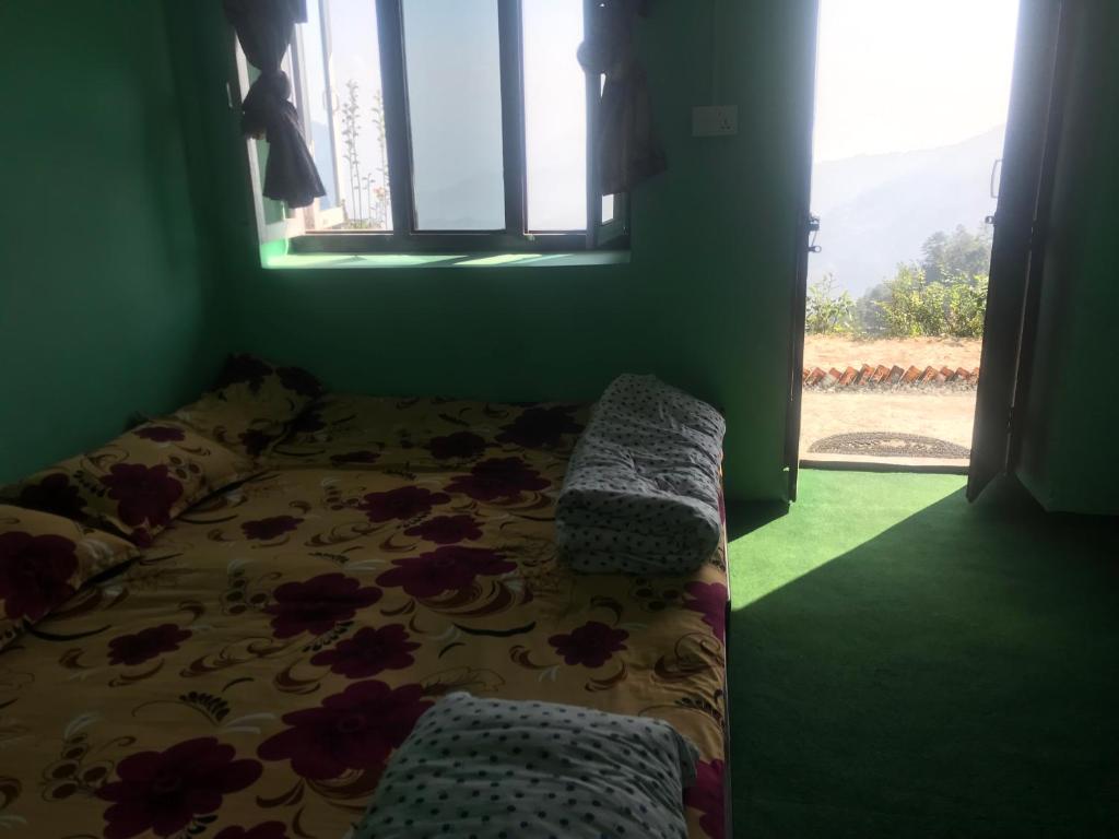 Postel nebo postele na pokoji v ubytování Sunrise Point Homestay