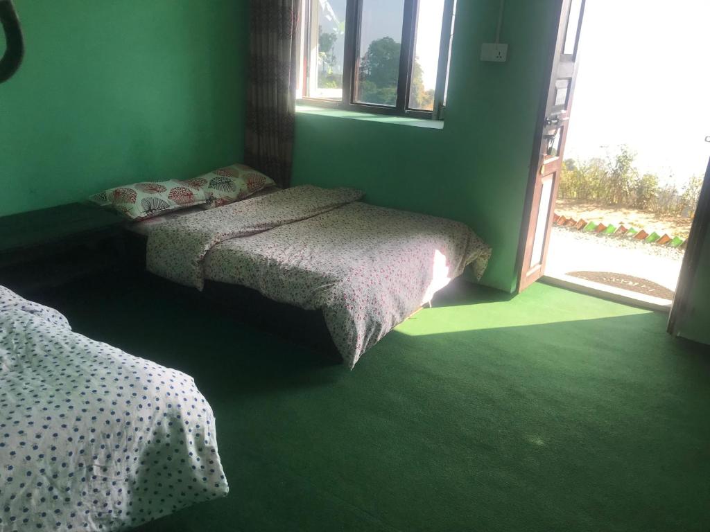 Postel nebo postele na pokoji v ubytování Sunrise Point Homestay