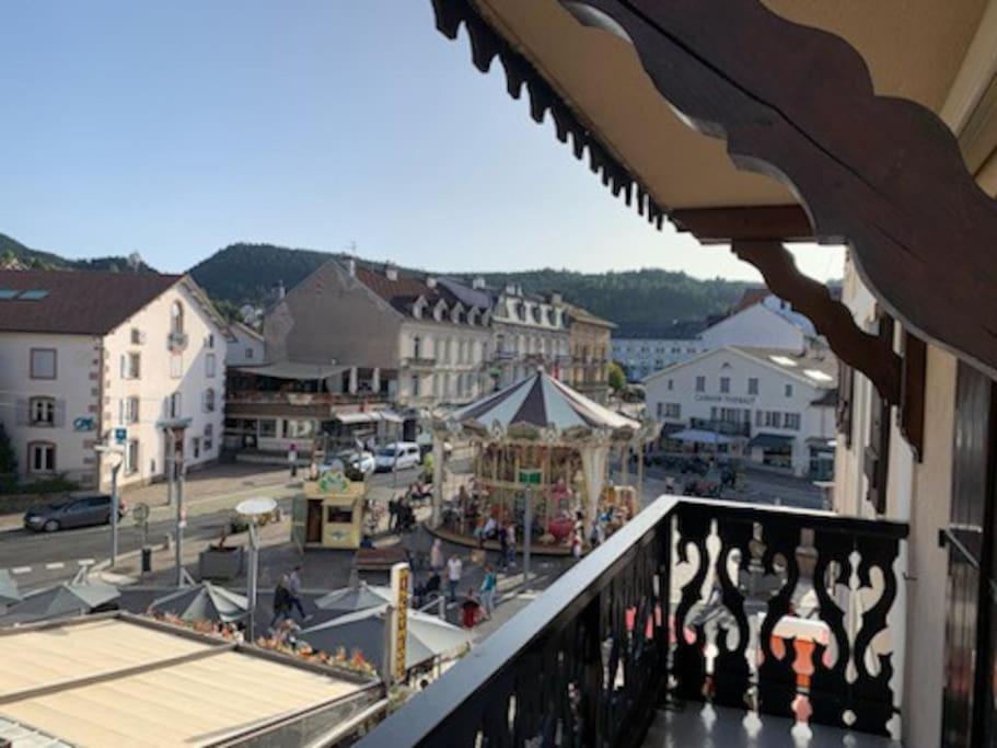 a view of a town from the balcony of a building at LE COEUR DE GERARDMER F2 PLEIN CENTRE 4P + GARAGE in Gérardmer