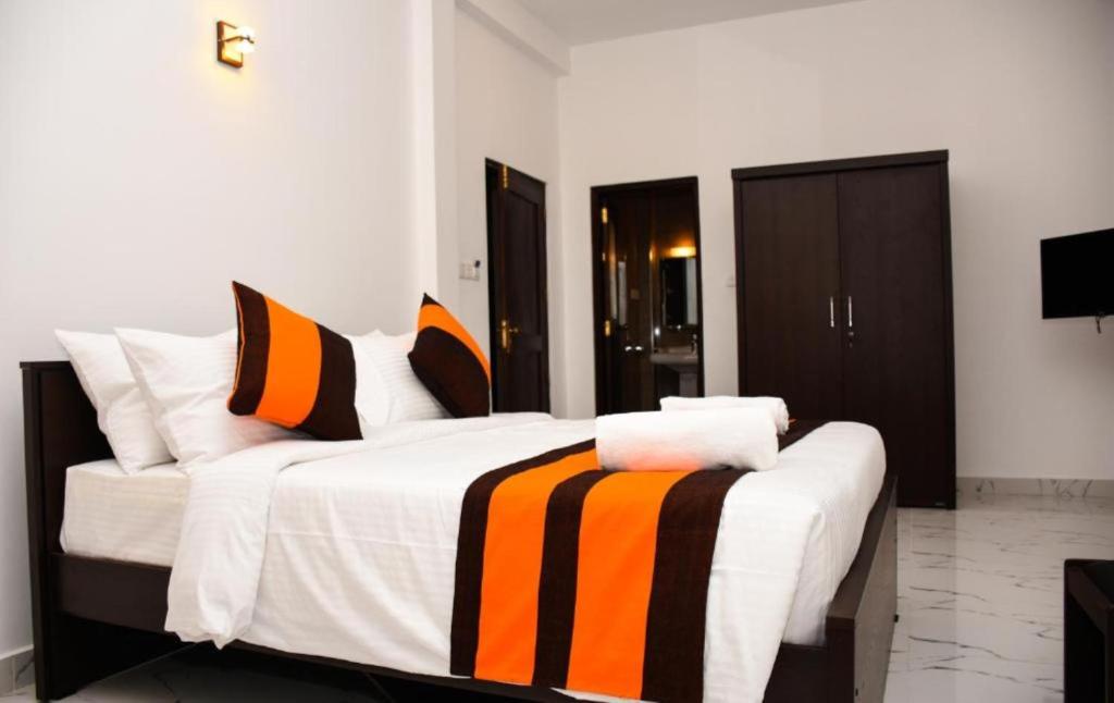 Postel nebo postele na pokoji v ubytování Mamma Raji Hotel - Freedom Paradise