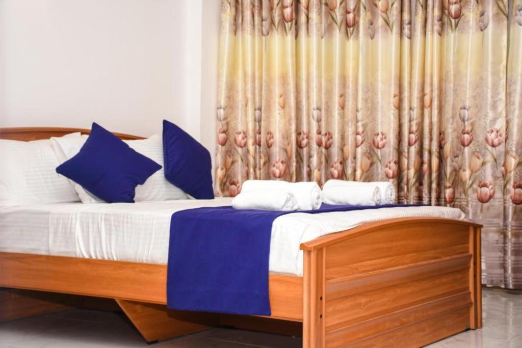 Postel nebo postele na pokoji v ubytování Mamma Raji Hotel - Freedom Paradise
