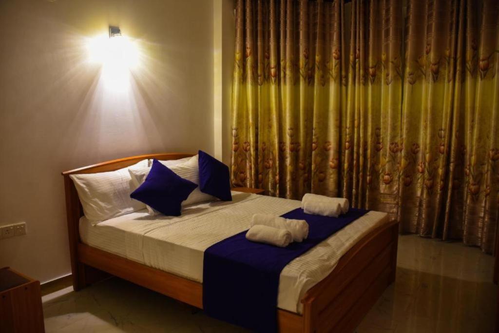 Postel nebo postele na pokoji v ubytování Mamma Raji Hotel - Freedom Paradise