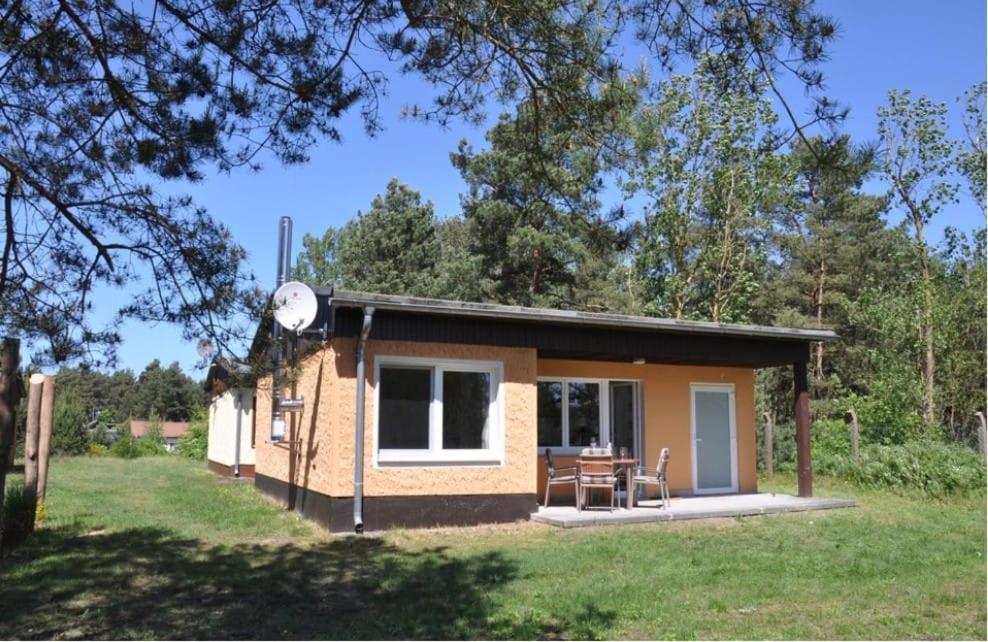 a small house with a clock on the side of it at Haus Matti in Pruchten