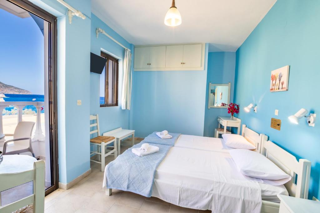 Postel nebo postele na pokoji v ubytování P i g a d i a B a y