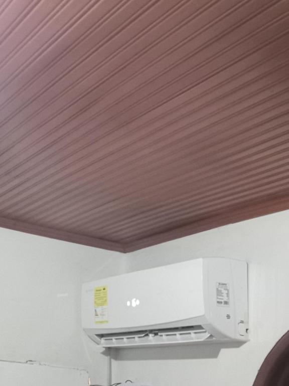 a wooden ceiling in a room with a printer at Comoda habitacion in Valledupar