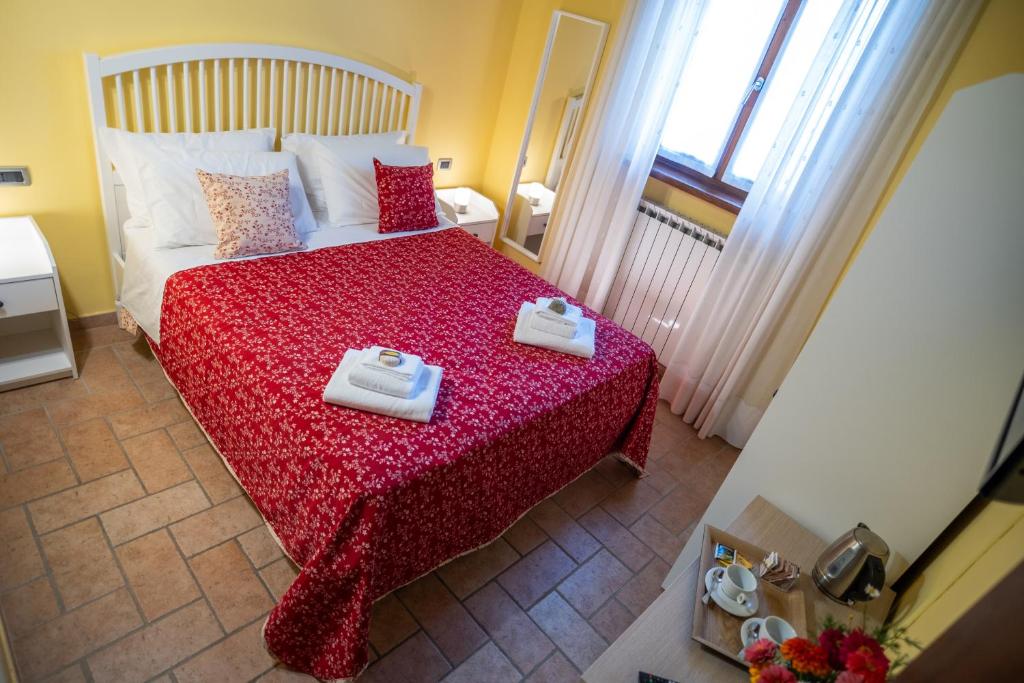 Postel nebo postele na pokoji v ubytování Casa Lidia Gavi