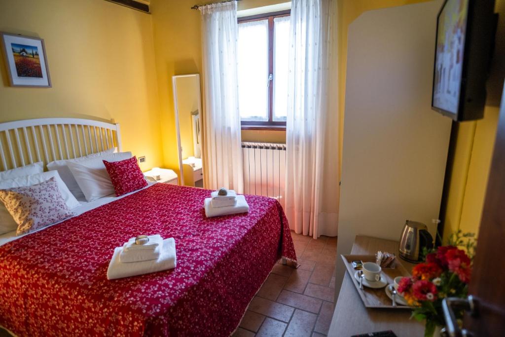 Postel nebo postele na pokoji v ubytování Casa Lidia Gavi