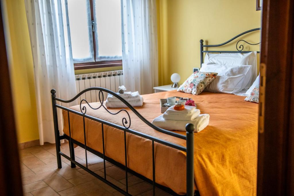 Postel nebo postele na pokoji v ubytování Casa Lidia Gavi
