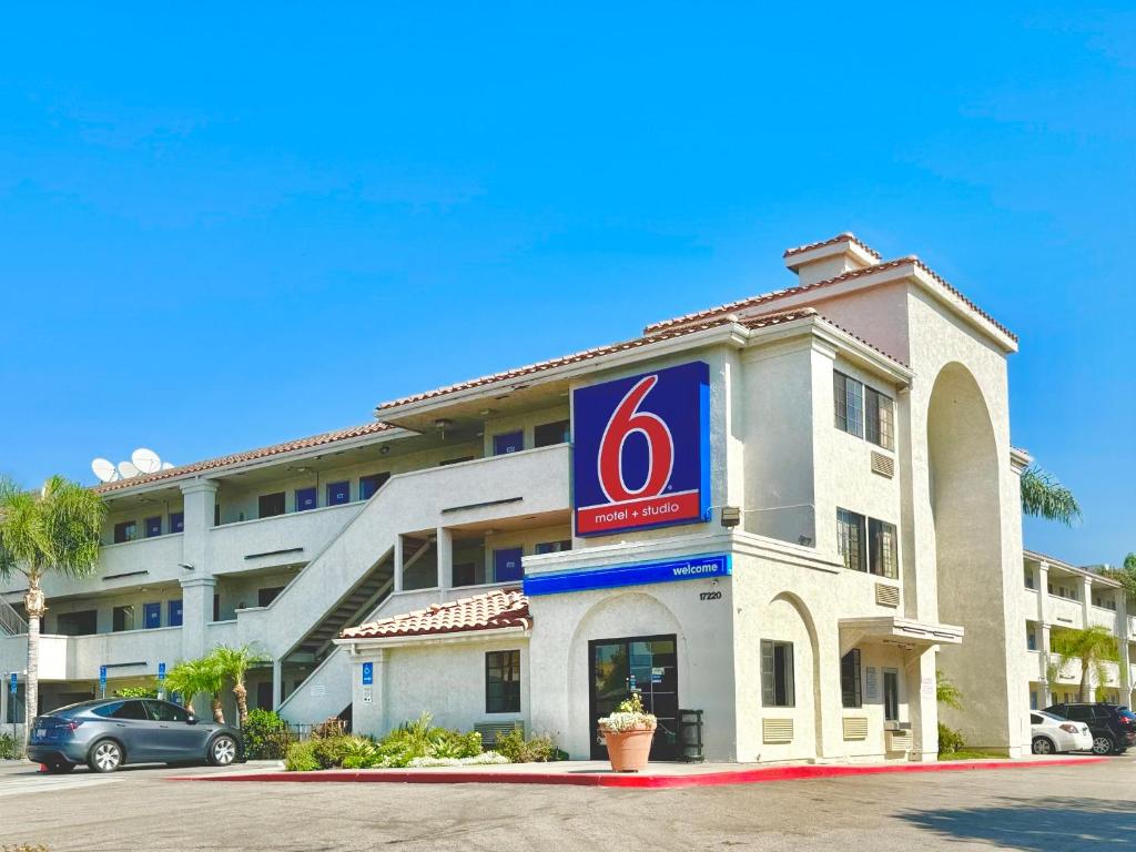 a hotel with a sign on the front of it at Motel 6-Bellflower, CA - Los Angeles in Bellflower