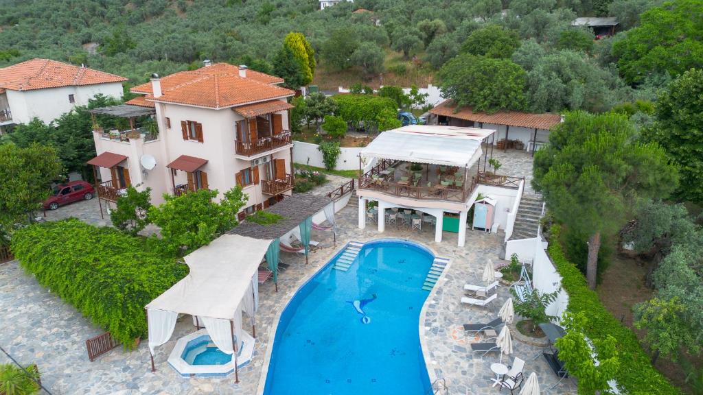 an aerial view of a house with a swimming pool at Seralis Pelion in Afissos