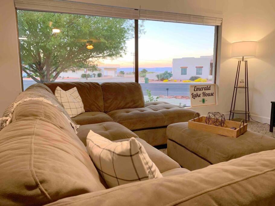 a living room with two couches and a large window at Emerald Lake House *Boat Parking with a View in Page