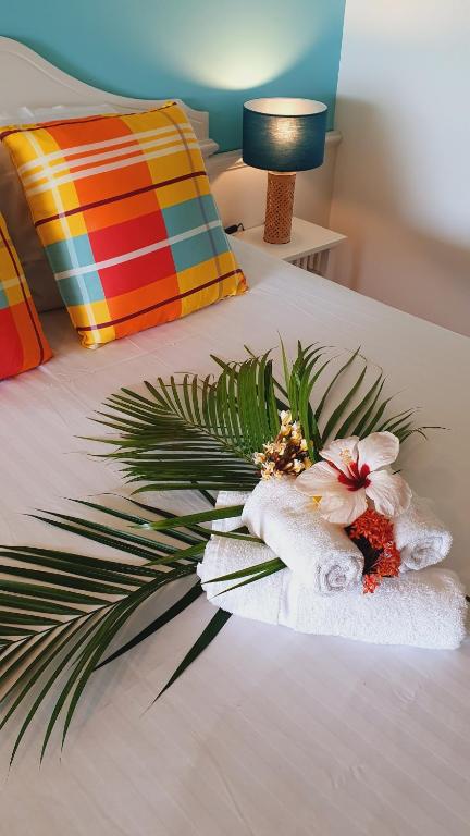 Postel nebo postele na pokoji v ubytování TI OASIS Trinidad, Studio vue Mer à Pierre & Vacances