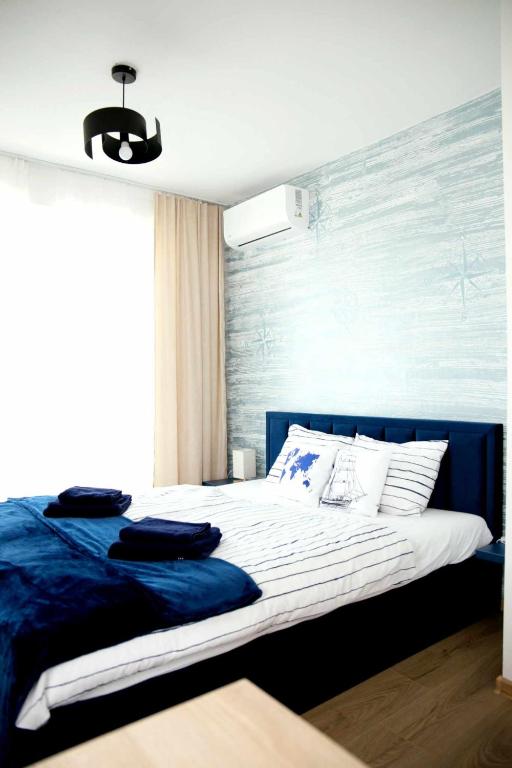 Postel nebo postele na pokoji v ubytování Ahoy Relax Apartmany Nesvady