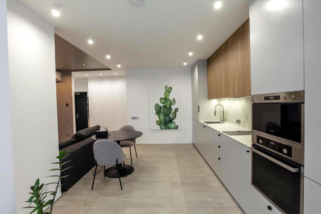 Kuchyň nebo kuchyňský kout v ubytování Cactus Apartments 2