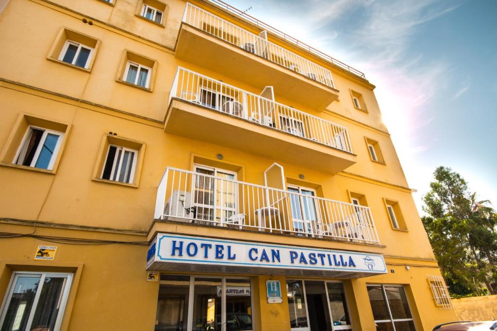 a building with a sign on the front of it at Hotel Amic Can Pastilla in Can Pastilla