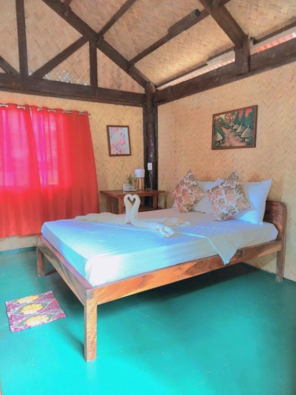 Postel nebo postele na pokoji v ubytování Concepcion Divers Lodge