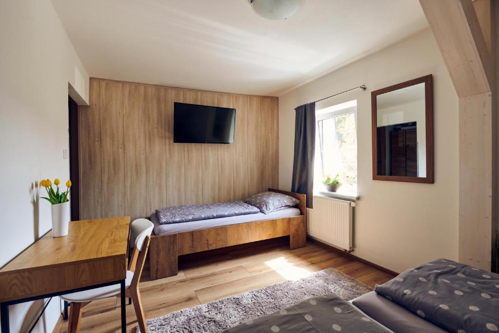 Postel nebo postele na pokoji v ubytování Na Rozcestí Frýdlant
