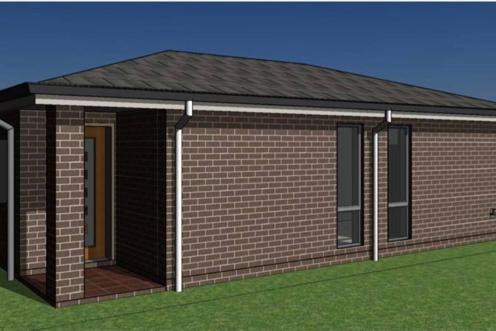 a rendering of a small brick house with a roof at Granny Guest house Sydney Blue Mount in Kingswood