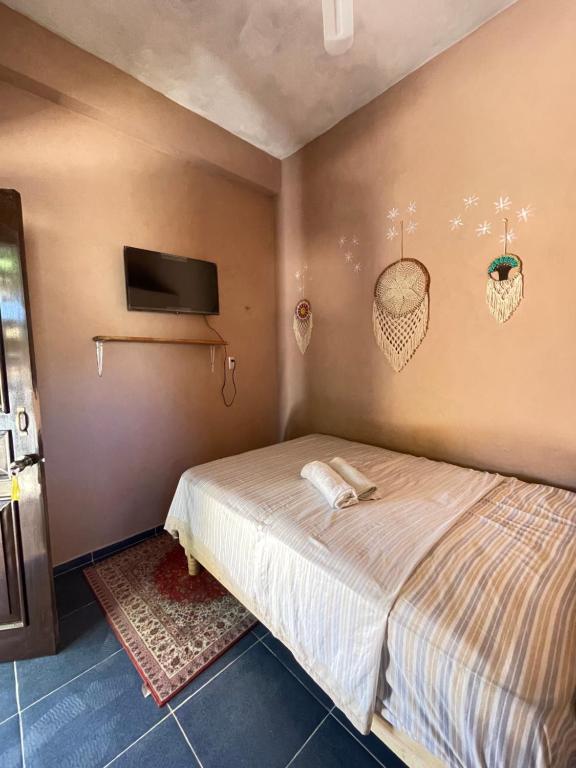 Postel nebo postele na pokoji v ubytování Casa Lol-cab Hostal