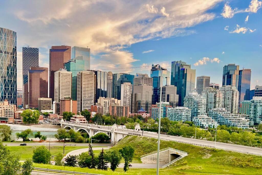 a view of a city with a bridge and buildings at Crescent Heights Majesty in Calgary