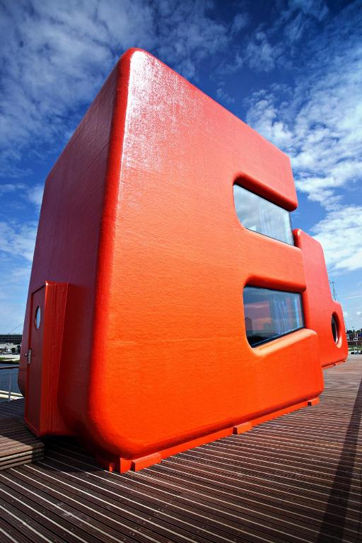 an orange object sitting on top of a building at Botel in Amsterdam