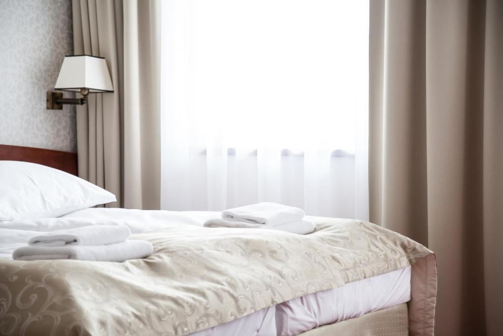 Posteľ alebo postele v izbe v ubytovaní Hotel Stara Gorzelnia