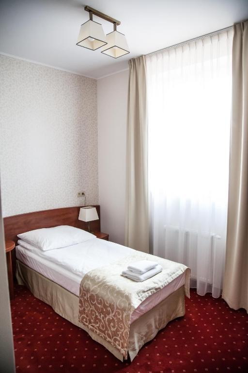 Posteľ alebo postele v izbe v ubytovaní Hotel Stara Gorzelnia