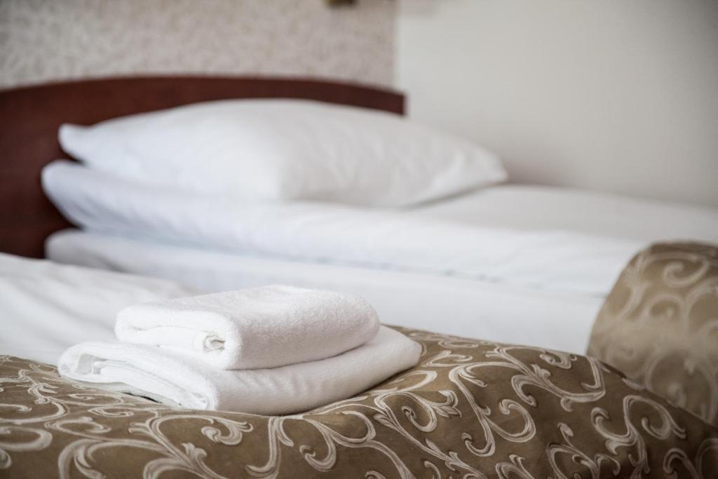 Posteľ alebo postele v izbe v ubytovaní Hotel Stara Gorzelnia