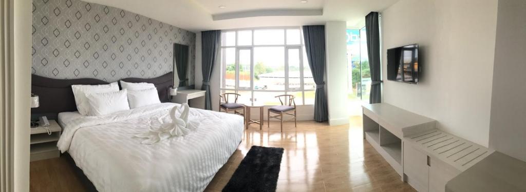 Postel nebo postele na pokoji v ubytování Avada Hotel