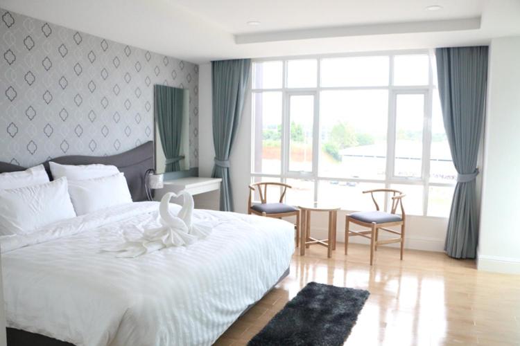 Postel nebo postele na pokoji v ubytování Avada Hotel