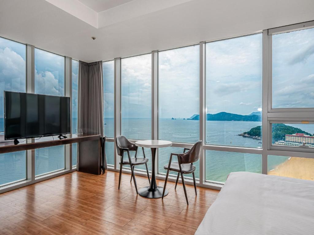 a hotel room with a view of the ocean at Haeundae Seacloud Hotel Residence in Busan