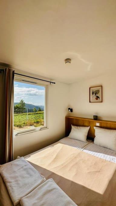 Postel nebo postele na pokoji v ubytování Mariseltinyhouse