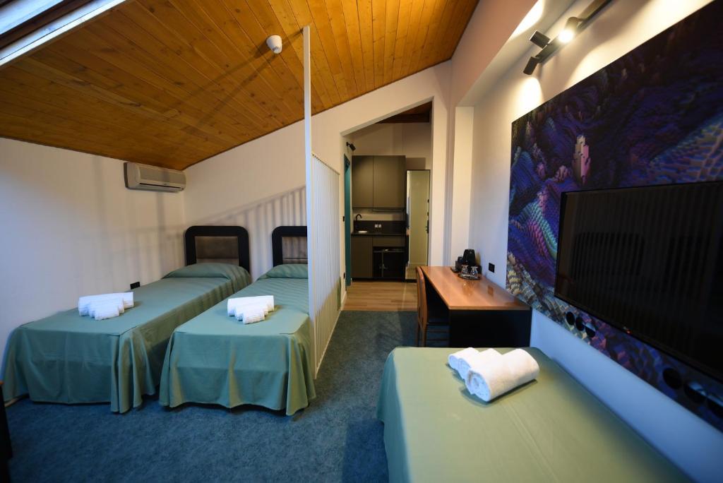 Postel nebo postele na pokoji v ubytování Hotel Celis
