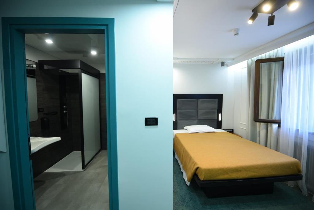 Postel nebo postele na pokoji v ubytování Hotel Celis