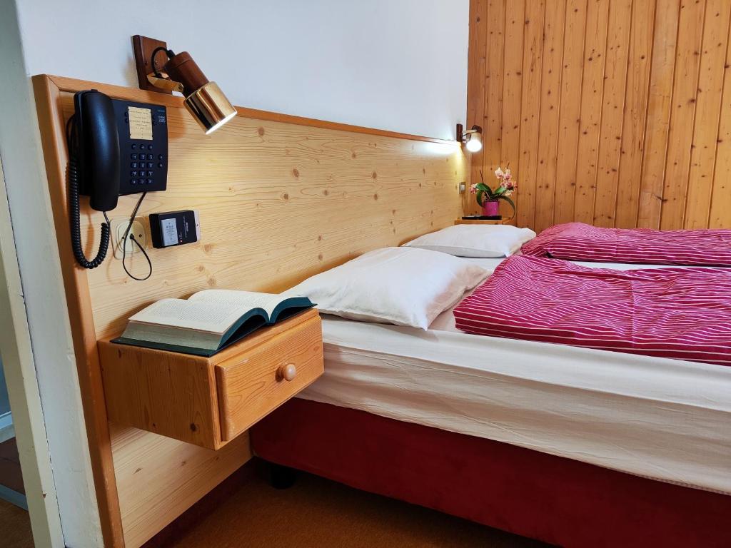Postel nebo postele na pokoji v ubytování Albergo Pensione Sport