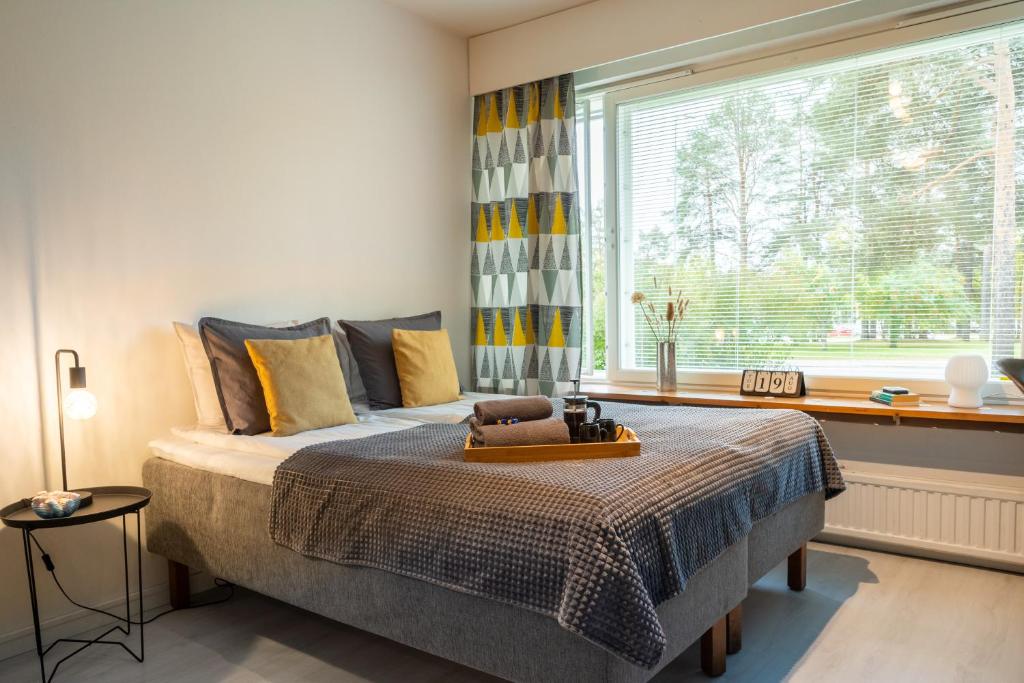 Postel nebo postele na pokoji v ubytování Rovaniemi, cozy studio near the city center