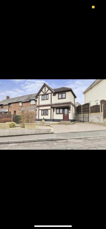 a picture of a large house on a street at Dorterry House in Ilkeston