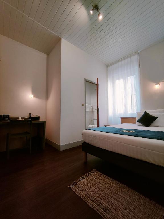 Postel nebo postele na pokoji v ubytování Will's Hotel