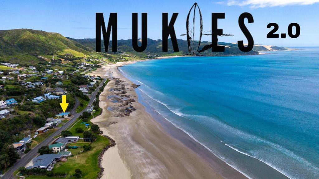 an aerial view of the beach with the words mitzes writtenimposed at Foreshore Mukies 2,0 in Ahipara