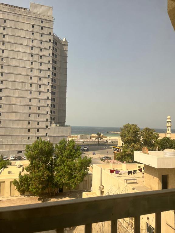 a view of a city from a balcony at تاج الكورنيش عجمان in Ajman 