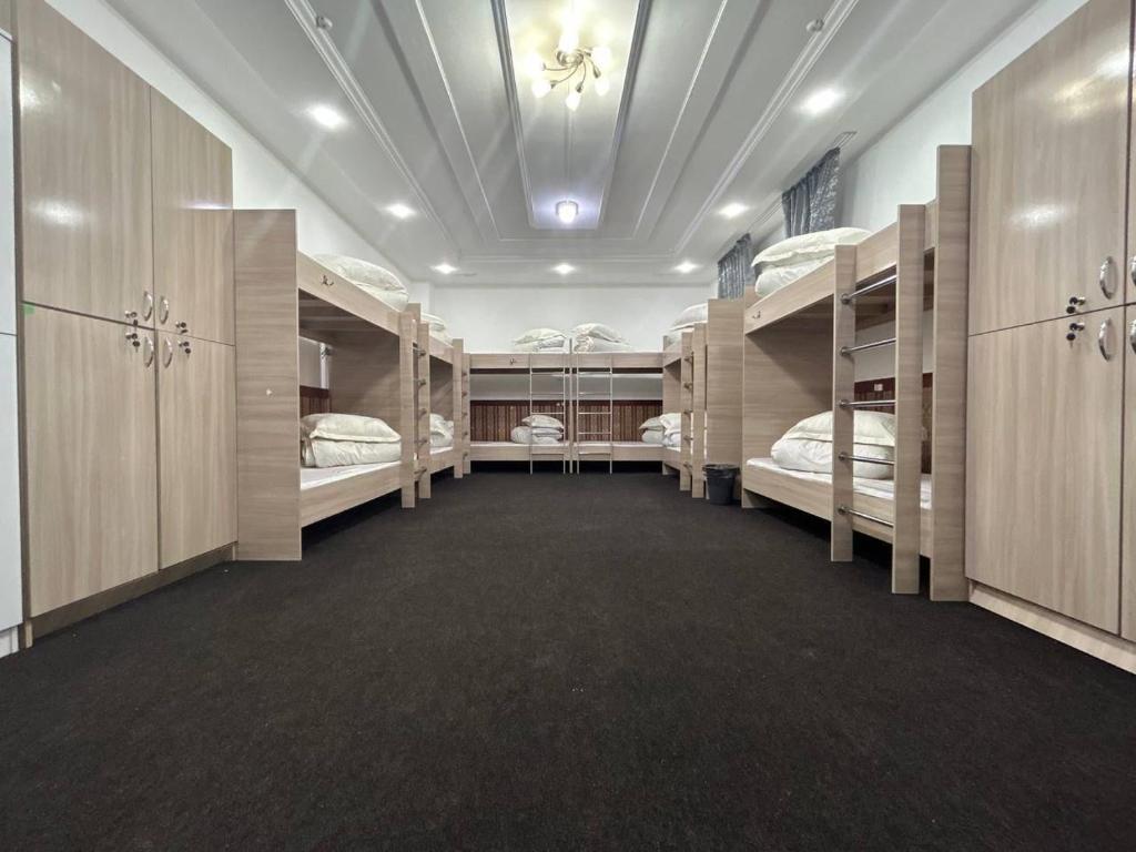 a large room with multiple bunk beds in it at STAR in Almaty
